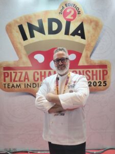 Italian pizza consultant Chef Joe Stanchi judging pizzas at India Pizza Championship 2025 in Mumbai